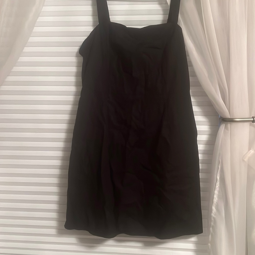 a black mini dress. size large. brand new, with tags.